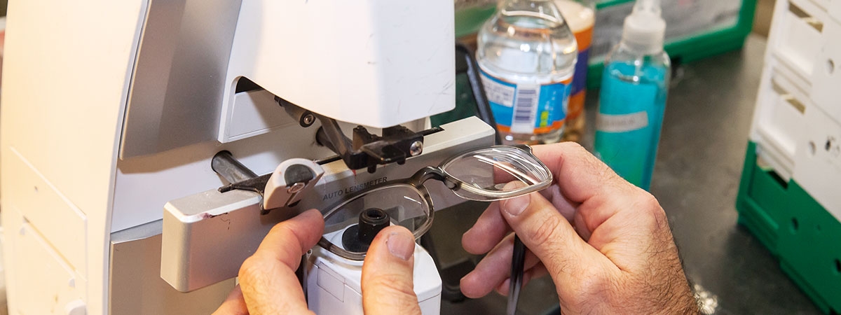 picture of lab tech inspecting frames